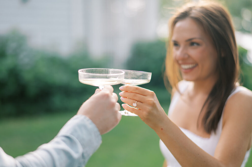 A celebratory toast for an upcoming lake erie wedding