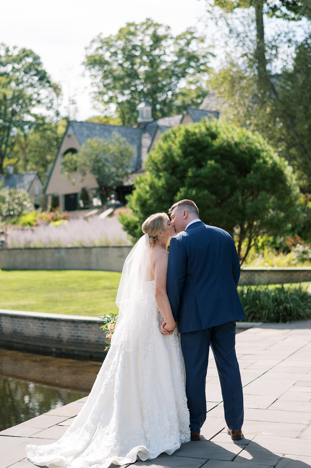 Northeast Ohio newlyweds exchange a kiss at Basil Place Wedding Venue