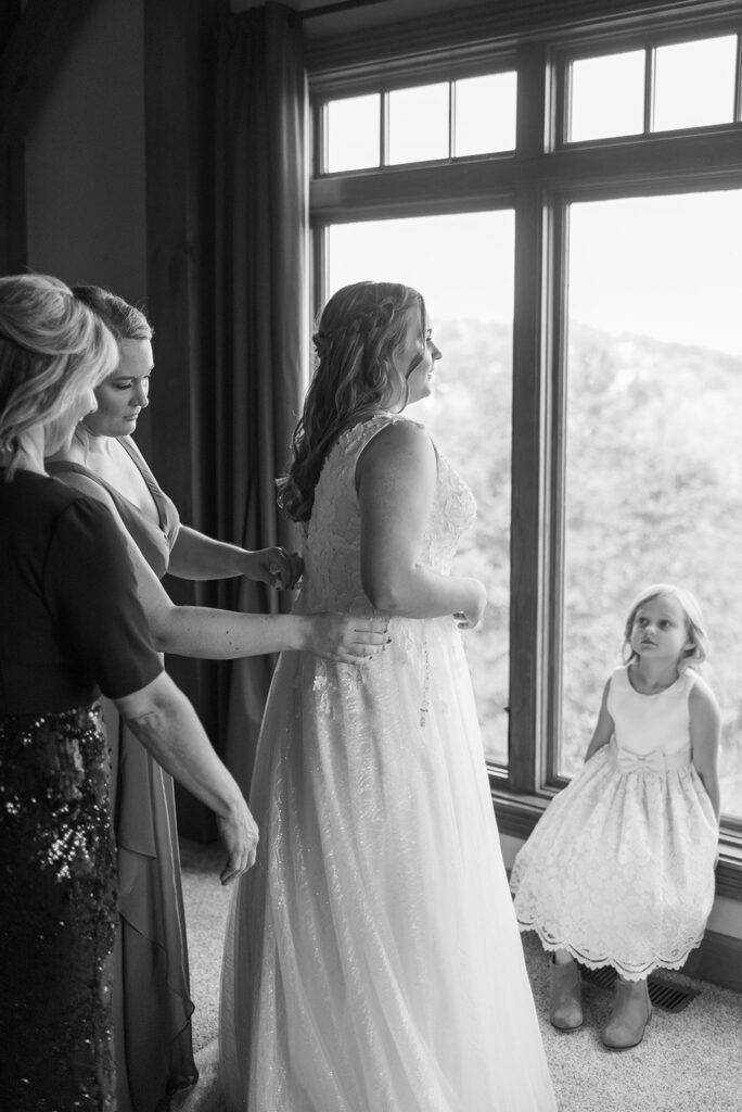 A black and white shot of a bride getting ready for her wedding day at Cades Cove