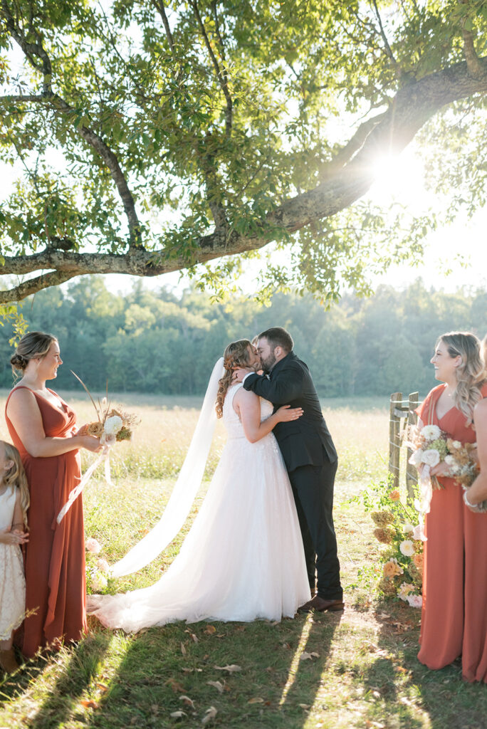 Newlyweds exchange a kiss at LeQuire Cemetary outlook at their wedding cades cove TN